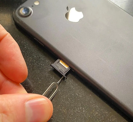 Eject SIM card.