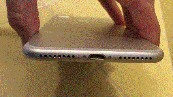 A cotton swab is in iPhone’s charging port